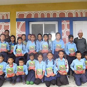 School children with red panda conservation manual